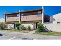 Inviting townhome featuring a private courtyard and lush greenery, offering a serene outdoor space at 1880 N Crystal Lake Dr # 35, Lakeland, FL 33801