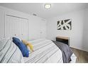 Cozy bedroom with neutral tones, comfortable bedding, and ample closet space at 300 Keswick Ave, Davenport, FL 33897