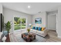 Bright living room with sliding glass doors and contemporary decor at 302 Ave P Nw, Winter Haven, FL 33881
