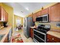 Well-equipped kitchen featuring stainless steel appliances and ample counter space at 3137 Winchester Estates Loop, Lakeland, FL 33810