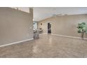 Open-concept living room boasts tiled floors, neutral walls, and airy atmosphere at 3173 Sand Trap Ct, Lakeland, FL 33810