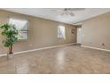 Inviting living room featuring neutral paint, tiled floors, and bright windows at 3173 Sand Trap Ct, Lakeland, FL 33810