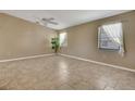 Airy living room with tile floors, neutral walls and plentiful natural light at 3173 Sand Trap Ct, Lakeland, FL 33810