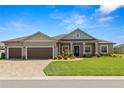 Charming single-story home featuring a well-manicured lawn and a spacious two car garage at 5020 Truman Ln, Lakeland, FL 33812
