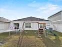 Spacious backyard features play equipment, open space, and a well-maintained lawn at 1341 Mattie Pointe Blvd, Auburndale, FL 33823