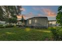 Relaxing backyard featuring lush green grass and a cozy patio, perfect for outdoor enjoyment at 1610 Reynolds Rd # 50, Lakeland, FL 33801
