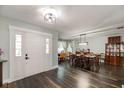 Spacious foyer with wood floors and a view into the dining area at 1931 Matthew Ct, Lakeland, FL 33813