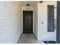Close-up of the home's elegant front door, with its classic design and welcoming ambiance at 221 Stevenson Rd, Winter Haven, FL 33884