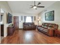 Comfortable living room with hardwood floors, leather seating, and a bright, welcoming atmosphere at 2329 Duff Rd, Lakeland, FL 33810