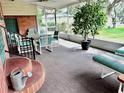 Relaxing screened patio with seating area, perfect for enjoying the outdoors at 302 Luna Rd, Auburndale, FL 33823
