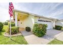 Beautiful one story home with manicured landscaping, sidewalk, and an attached two-car garage at 3080 Westmoreland Dr, Lakeland, FL 33810
