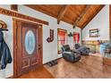 Inviting entryway with wood accents, tile floors, comfortable seating, and charming decor at 3530 Hamilton Rd, Lakeland, FL 33811