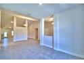 Bright and airy living room with tile flooring and open layout, perfect for entertaining at 4322 Juliana Lake Dr, Auburndale, FL 33823