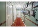 Inviting hallway with decorative wall art leads into the home's living spaces at 530 Heather Ct, Bartow, FL 33830