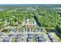 An aerial view showcasing neighborhood with lush green space and ponds at 7445 Ibis Dr, Lakeland, FL 33810
