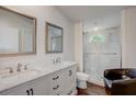 Modern bathroom featuring double sinks and a glass-enclosed shower at 900 Saddlewood Blvd, Lakeland, FL 33809