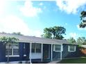 Beautifully painted single-story home with a covered front porch and well-maintained landscaping at 1024 31St Nw St, Winter Haven, FL 33881