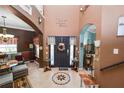Spacious foyer with tile flooring, staircase, and charming decor creates a welcoming ambiance at 181 James Cir, Lake Alfred, FL 33850