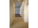 The long hallway features tile floors, arches and lots of natural light from rooms at the end at 3817 Osprey Pointe Cir, Winter Haven, FL 33884