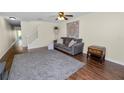 Bright living room featuring hardwood floors, a ceiling fan, and neutral decor at 5407 River Rock Rd # 5407, Lakeland, FL 33809