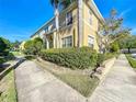 Well-maintained condo building with lush landscaping, mature palms, and a beautiful facade at 5458 Quarry Rock Rd, Lakeland, FL 33809