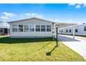 Charming single-story home with well-maintained lawn and inviting curb appeal on a sunny day at 6608 Westchester Ne Dr, Winter Haven, FL 33881