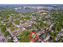 Overhead view of a neighborhood with tree-lined streets, showcasing the property's location near a lake and urban center at 923 Lexington St, Lakeland, FL 33801