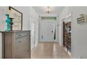 Welcoming foyer with tile flooring, natural light, and stylish decor elements at 955 Hunters Meadow Ln, Lakeland, FL 33809