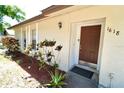 Close-up of a home's entrance with decorative plants at 1618 Crystalview Trl, Lakeland, FL 33801