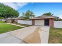 Spacious detached garage with driveway and fenced yard, perfect for parking and outdoor activities at 202 Saint Lucie Rd, Winter Haven, FL 33884