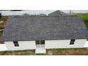 Aerial view of home and roof, back sliding door, and fenced yard at 7968 Charleston Blvd, Lakeland, FL 33810