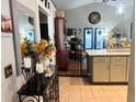 Open kitchen with granite countertops, modern appliances, and a view of the living area at 811 W Heron Pl, Winter Haven, FL 33884