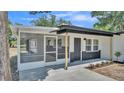 Charming single-story home featuring a screened porch and freshly painted exterior accents at 1650 W Mcleod St, Bartow, FL 33830