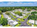Community aerial view showcasing lush surroundings and a peaceful residential area at 635 Cottage Ln # 635, Lakeland, FL 33803