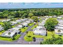 Scenic aerial shot of a well-kept neighborhood with tree-lined streets and manicured lawns at 635 Cottage Ln # 635, Lakeland, FL 33803