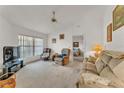 Comfortable living room featuring neutral carpet, cozy furniture, and ample natural light at 7230 Hileman W Dr, Lakeland, FL 33810