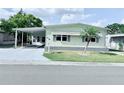 Charming single-story home with carport, well-maintained lawn, and cozy neighborhood feel at 1011 Pine Ridge Dr, Lakeland, FL 33809
