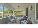 Cozy front porch with cushioned seating, outdoor rug, and decorative accents, offering a relaxing space at 1105 Terry S Ave, Lakeland, FL 33815