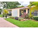Inviting single-story home with well-maintained landscaping and a charming front entrance at 1407 Easton Dr, Lakeland, FL 33803