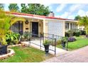 Charming home with vibrant landscaping, decorative accents, and a welcoming front entrance at 1407 Easton Dr, Lakeland, FL 33803
