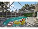 Screened-in pool area perfect for relaxation and entertaining in the Florida sunshine at 1573 Avleigh Cir, Orlando, FL 32824