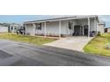 Charming home featuring a side driveway, storage shed, and well-maintained landscaping at 2055 S Floral Ave # 269, Bartow, FL 33830