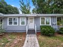 Attractive home exterior featuring neutral siding, bright white trim, and walkway at 219 Ariana St # A-B, Lakeland, FL 33803