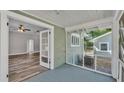 Inviting enclosed porch with access to the living room and views of the spacious backyard at 2203 Avenue F Nw, Winter Haven, FL 33880