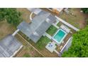 Aerial view of home with fenced pool and a well-manicured backyard at 2332 S Crystal Lake Dr, Lakeland, FL 33801