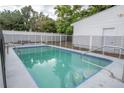 A refreshing in-ground pool, perfect for relaxation and entertainment, is fully fenced at 2332 S Crystal Lake Dr, Lakeland, FL 33801