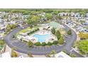 Aerial view of community pool and recreation area surrounded by lush landscaping at 2511 Limewood Ave, Clermont, FL 34714