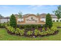 Elegant Wind Meadows South community sign surrounded by lush landscaping and trees at 2726 Red Egret Dr, Bartow, FL 33830