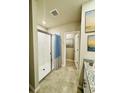 Bathroom with glass enclosed shower, granite countertop, and modern fixtures at 3208 Weitzel Dr, Haines City, FL 33844