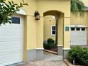 Inviting archway detail leading to the front entrance and garage at 3923 Serenade Ln # 426, Lakeland, FL 33811